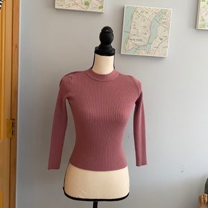 A kids soft magenta long sleeve top
